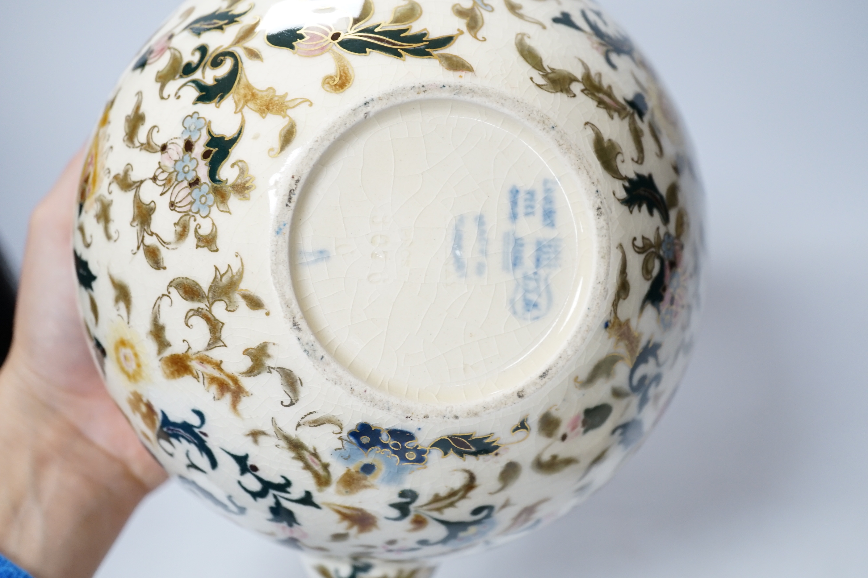 A Zsolnay teapot, teacup and sugar bowl, tallest 22cm
